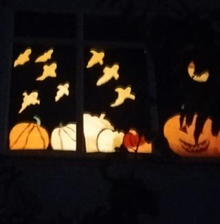 Decorate window, path and door decorated for Halloween evening, treats on 31st